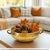 Dimensions: 12" W X 10" D X 4" H Bowl size with handle - 12" Wide Interior bowl dimension - 10" diameter Features: • Brass...