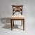 Biedermeier side chair with an upholstered seat and a stained beechwood frame. The unusually designed backrest features...