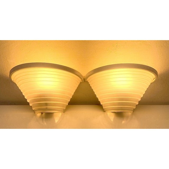 Italian vintage Postmodern wall lights with white sanded glass shade on a painted metal frame / Designed by Angelo...