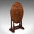 This is a vintage folding oval occasional table. An English, oak and elm gate leg serving or supper table in Jacobean...