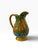 Vintage Florida souvenir palm tree pitcher. Blue and green on a back drop of saffron. Measures 5” x 3.5” x 6”. No cracks,...