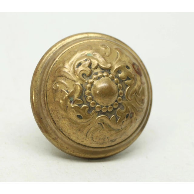Gothic style spiral and swirls brass passage door knob was made by Lockwood in 1914 catalog. It is part of the E-13710...