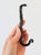 Black cast iron snake wall hook features a textured serpentine silhouette with a curled tail acting as the hanging peg. No...