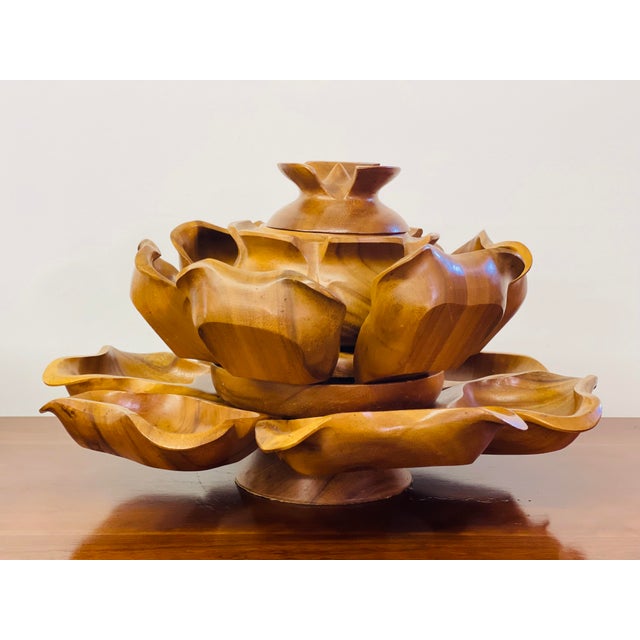 Like new, never used. Gorgeous Polynesian Monkey Pod Serving Set. Perfect conversation piece! Includes 12 bowls and the...