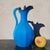 Blue glass pitcher or carafe with a nickel silver lid. Good overall condition, one pin is missing from the lid hinge....