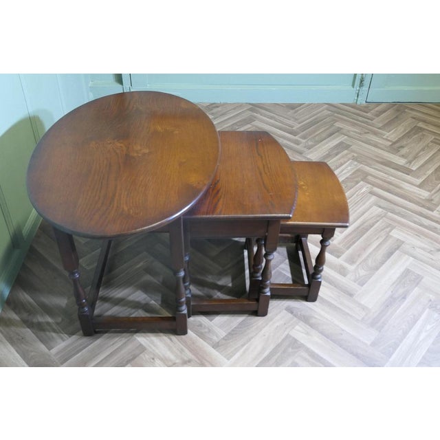 Oval Nest of Tables in Oak by Old Charm This is a very unusual set of tables, the largest table is Oval in shape and the...
