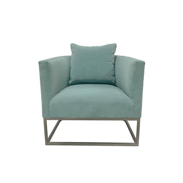 This custom upholstered Declan occasional chair from Century Furniture is finished in a pale turquoise low pile polyester...
