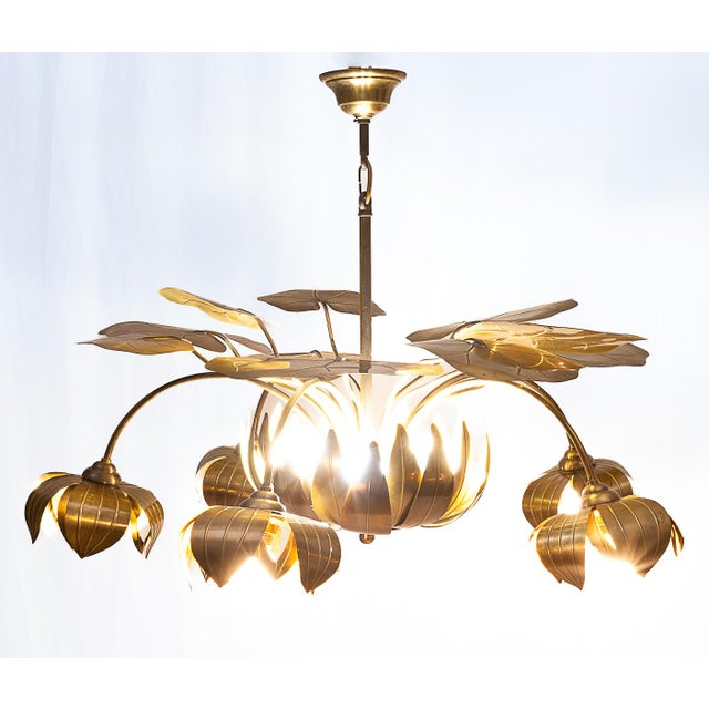 Important brass water lily chandelier by Christian Techoueyeres for Maison Jansen. 5 arms, 10 lights (5 in the central...
