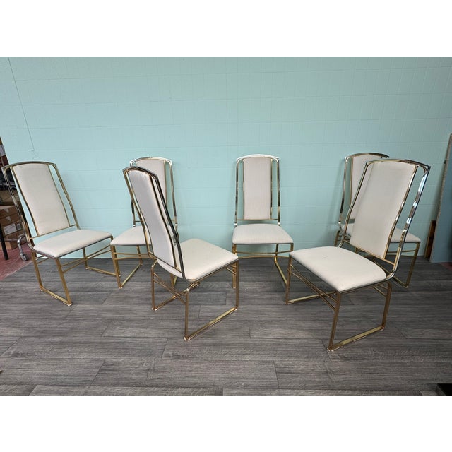 Set of six chairs, 1970s. Gold and chrome metal frame and white fabric upholstery.