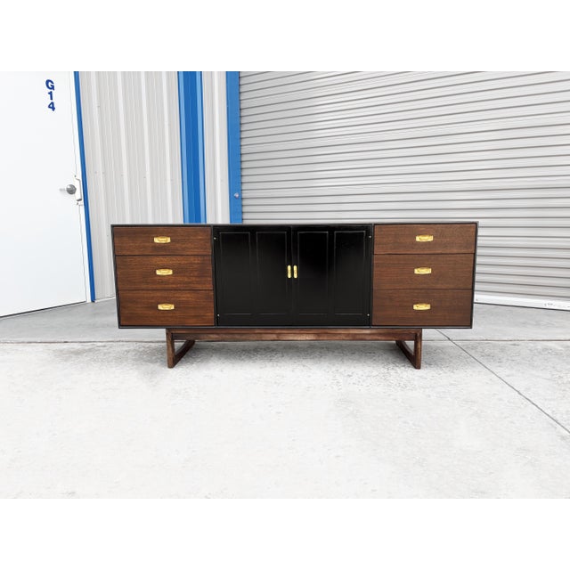 Mid-Century Modern Walnut Dresser by Drexel This beautifully crafted mid-century modern walnut dresser, designed by...