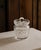 A beautifully crafted cut crystal biscuit jar with matching lid, circa 1950s–60s. The cylindrical body features an all-...