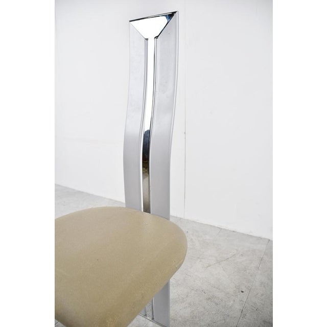 Italian metal postmodern dining chairs with grey/white lacquered wooden frames and chrome inserts in the backrests....