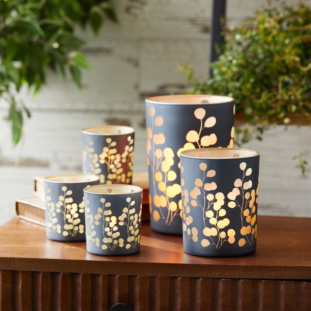 Add a sophisticated touch to your home with the Frosted Foliage Candle Holder Set. Featuring cool green tones and a...