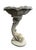 This garden focal point features a classic Neoclassical design, showcasing a stylized koi or dolphin pedestal that appears...