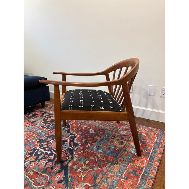 Elevate your space with this gorgeous mid-century modern inspired Windsor chair from Anthropologie — the Amara Chair....