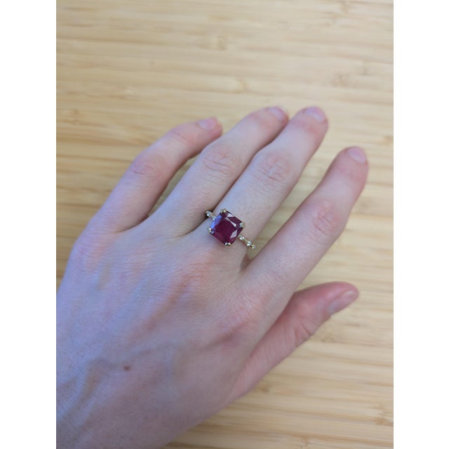 Make a bold statement with this 4.9-carat Madagascar ruby, set in solid 14k gold and accented with shimmering earth-mined...