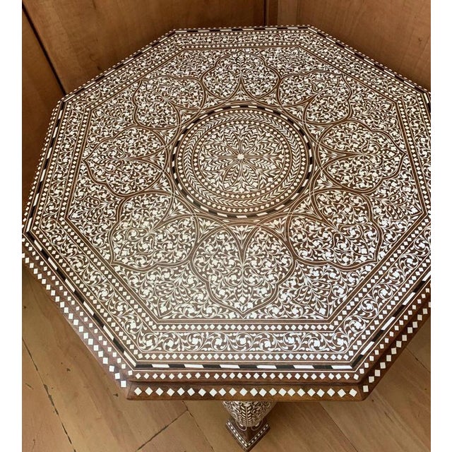 A highly decorative handmade Indian side table, finely crafted from Indian rosewood and extensively embellished with...