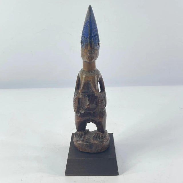 Ibeji figures, carved by the Yoruba people of Nigeria, are wooden twin sculptures holding cultural significance in Yoruba...