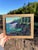 This oil painting captures a serene coastal scene at Presque Isle, showcasing rugged cliffs adorned with vibrant greenery...