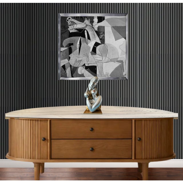 This modern 18-inch tall mid-century chalkware sculpture captures a timeless moment between two lovers in a tender...