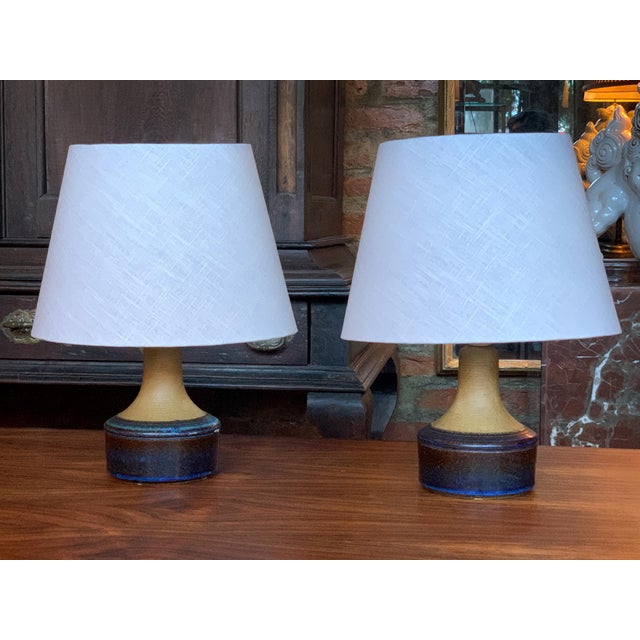 Hand-crafted in the 1970s by the stoneware factory Søholm Stentøj, these small table lamps have ceramic bodies with...