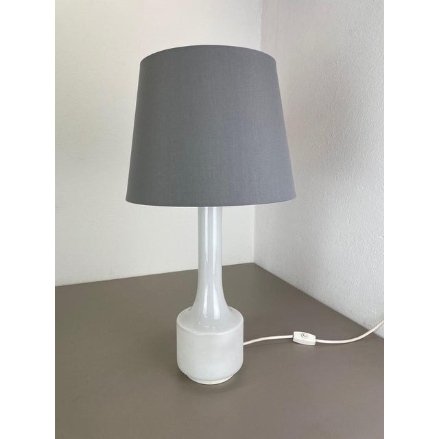 Article: Table light Producer: Doria lights, Germany Origin: Germany Age: 1970s This vintage table light was made by Doria...