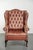 This classic English cowhide leather button seat Chesterfield wing armchair features a beautiful patina and lovely colors....