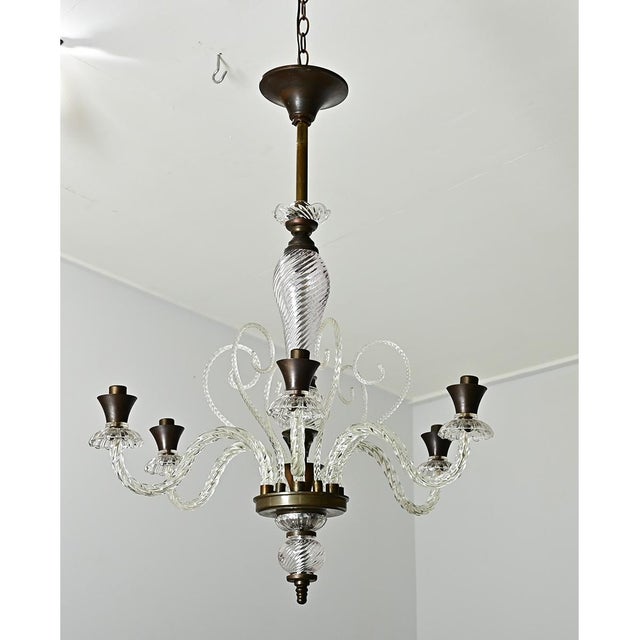 A whimsical Murano glass chandelier from Italy, midcentury circa 1940, in the style of Barovier & Toso using a technique...