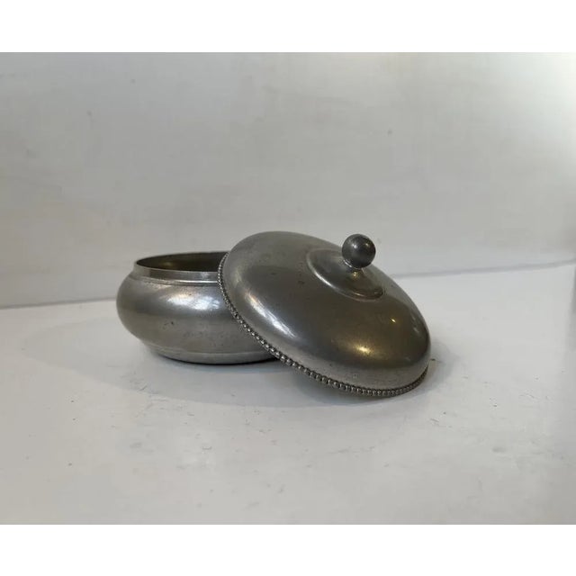 A rare pewter trinket in pewter. Clean strict design with beaded edge. Designed and manufactured by just andersen in...