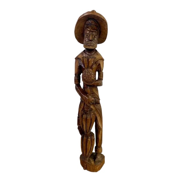 Folk Art Wood Sculpture of a Caribbean Man Holding a Pineapple For Sale