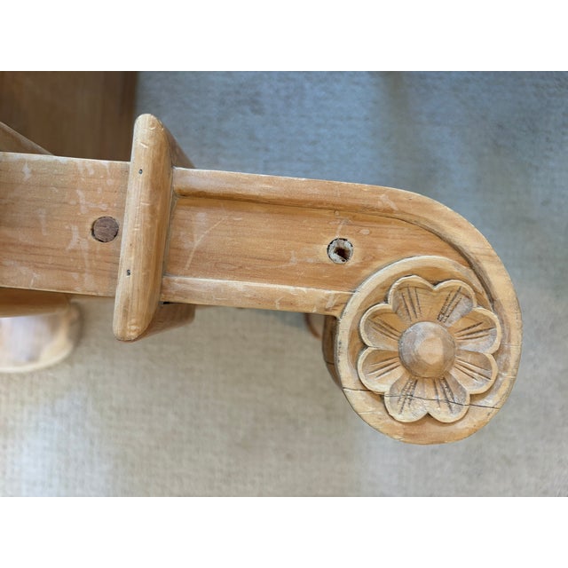 Solidly crafted wood bench. Hand Carved detail on the ends. Some of it has been reinforced with modern screws, but there...