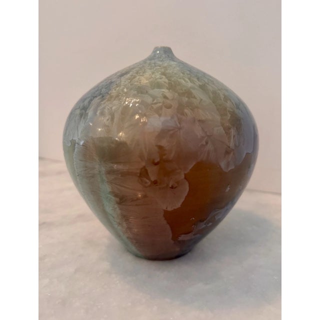 Signed studio pottery vase by Phil Morgan, dated 1991. This hand-crafted ceramic vessel features a rounded bulbous form...