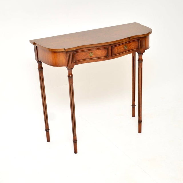A beautiful and elegant antique Regency style burr walnut console table. This was made in England, it dates from around...