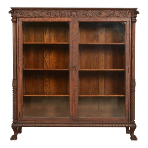R. J. Horner Style Victorian Oak Double Bookcase With Carved Lion Heads and Paw Feet, Circa 1890s