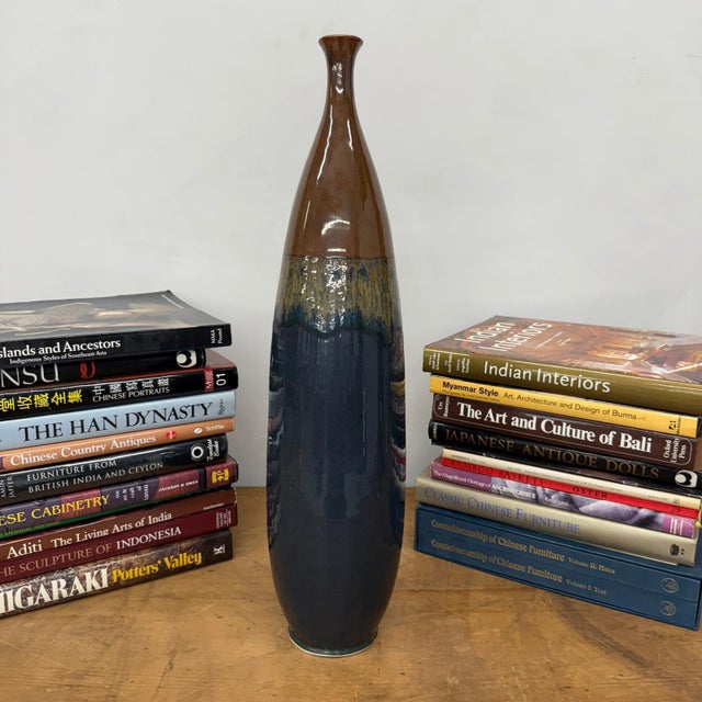 "About This Piece About This Piece Infuse your space with natural artistry through this tall brown and blue ceramic vase,...
