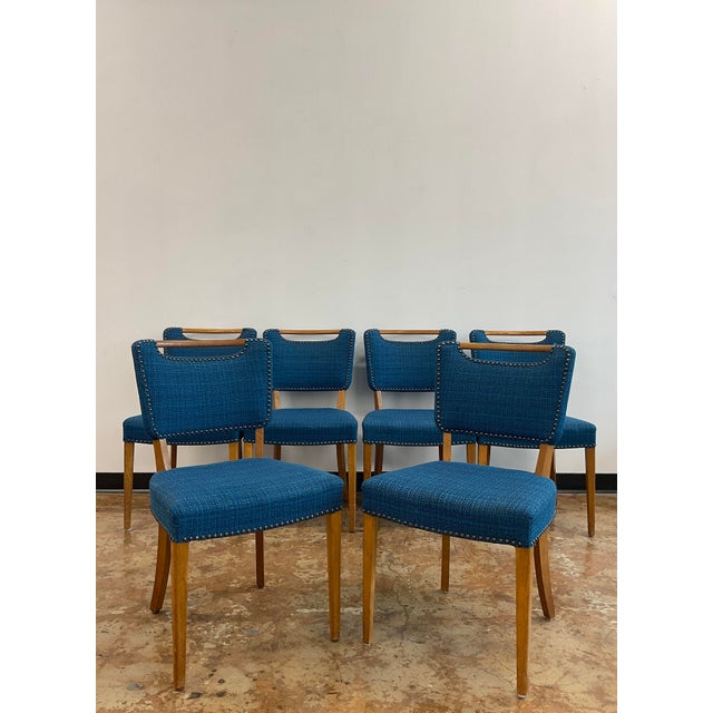 A set of six Scandinavian style MCM dining chairs from Slagelse Møbelværk, with oak frames and vibrant peacock blue wool...