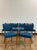 A set of six Scandinavian style MCM dining chairs from Slagelse Møbelværk, with oak frames and vibrant peacock blue wool...
