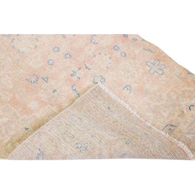 Beautiful vintage Persian Karajah hand-knotted shabby chic wool runner with a beige field. This rug has peach and blue...