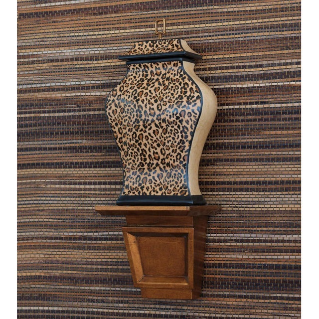 The patterned Leopard Jar is scaled at 6" deep to fit on your mantle or shelf. Accented with a solid brass ring finial,...