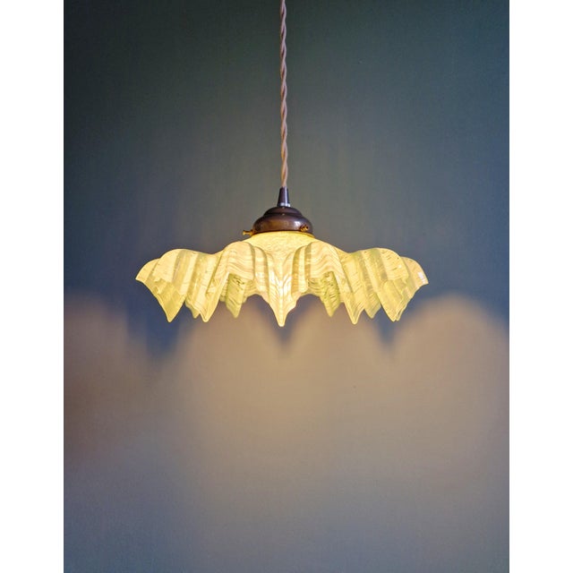 Art Deco pendant light in speckled green and white pleated glass, 1920s-30s. The pendant has been restored and is...