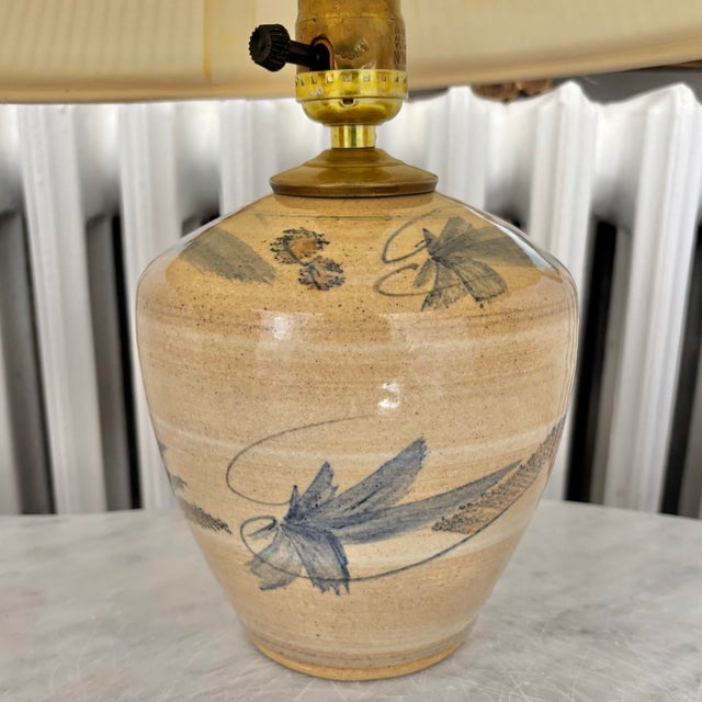 Gorgeous piece of mid century pottery. This folk art pottery table lamp with abstract design has no visible maker's mark....