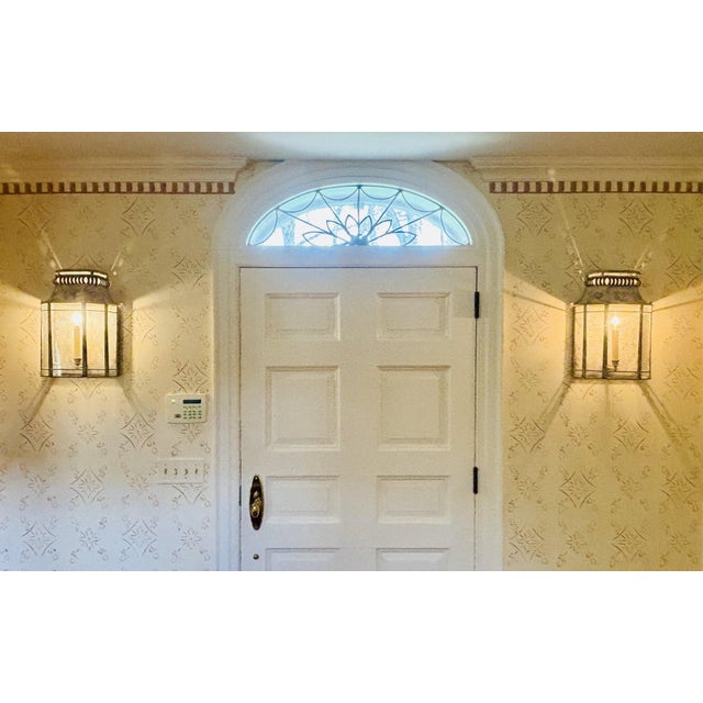 Pair Niermann Weeks patinated zinc wall lanterns in the neoclassical French taste with cast head of mercury and flower...