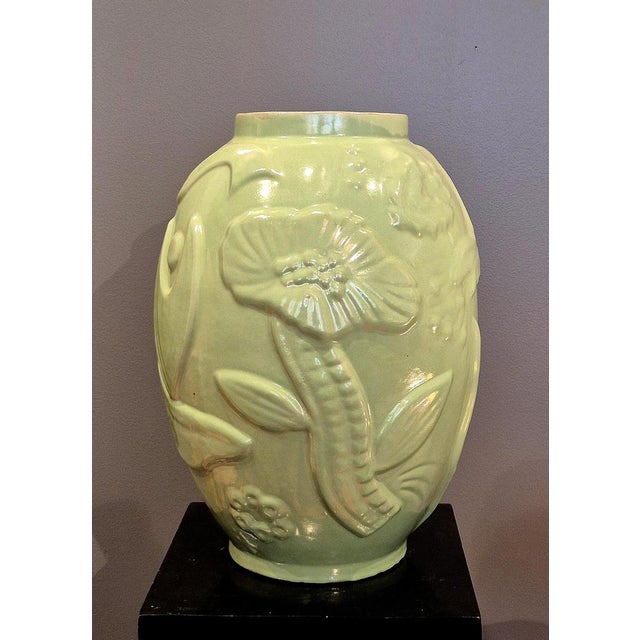 A large urn / vase by Anna-Lisa Thomson for Upsala Ekeby, mid-1900s. Made in earthenware with relief decor of fish and...