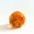 A lovely vintage art glass paperweight in a lovely orange color. Measures 2"Dia x 1.75"H
