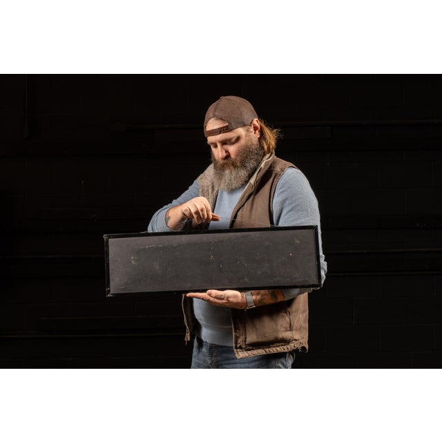 Mid-20th-century service station or automobile dealership sign advertising "USED CARS," constructed with a reflective...