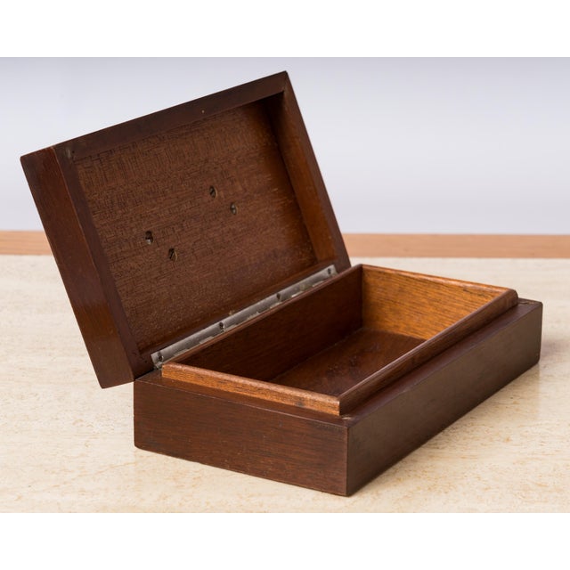 Art Deco stained wood decorative box, with nickel-plated bronze detail application on the lid.