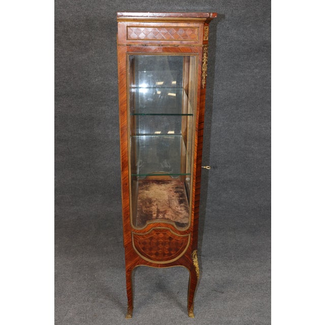 French Bronze-Mounted Walnut Vitrine in the Manner of François Linke This handsome French bronze-mounted walnut vitrine,...