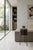 A sculptural side table made around 1970, characterized by the combination of a thick block of solid wood and a light...