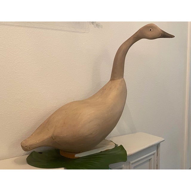 Woodcarved from two pieces of wood, this goose is large and will make a statement to your handcrafted collection of decoys.