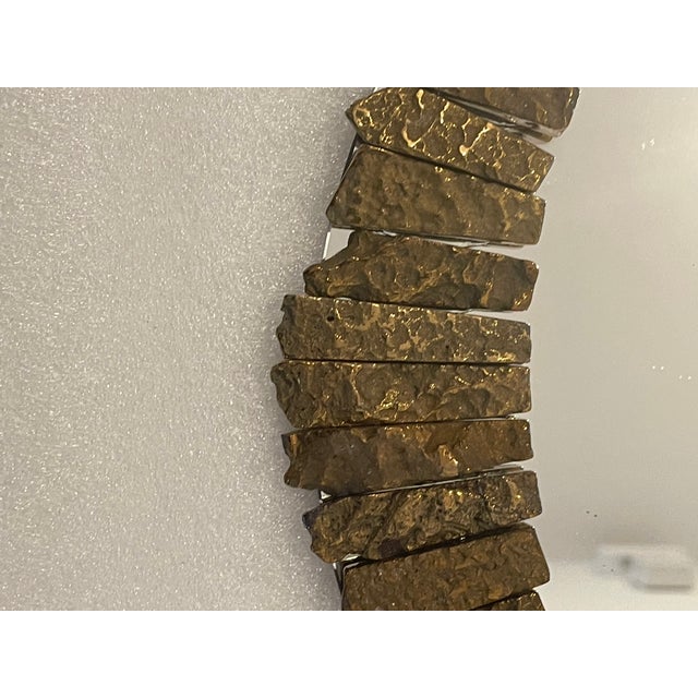 Vintage Tasselated oval mirror with gold agate stones in the style of Line Vautrin.